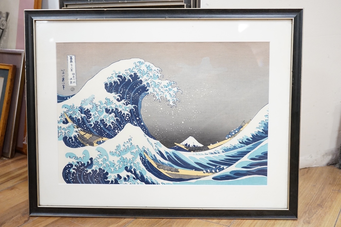 A set of ten Japanese woodblock prints to include ‘Great wave off the coast of Kanagawa’, ‘Fishermen at Kajikazawa’ and ‘Evening shower’, largest 25 x 36cm. Condition - fair